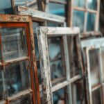 Old rustic window frames with peeling paint and glass